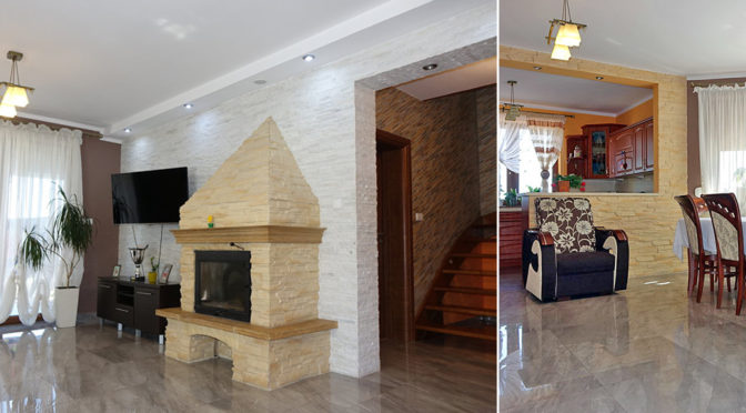 przestronny, elegancki salon z kominkiem oraz praktyczny aneks kuchenny w ekskluzywnej rezydencji do sprzedaży Toruń (okolice)