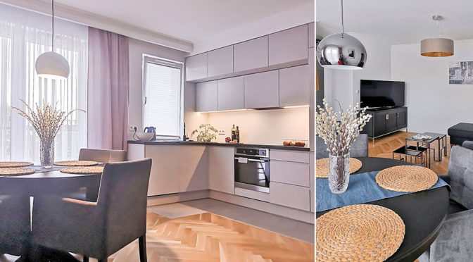 po lewej kuchnia, po prawej salon w ekskluzywnym apartamencie na sprzedaż Gdańsk